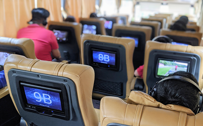 Person enjoying entertainment on a bus
